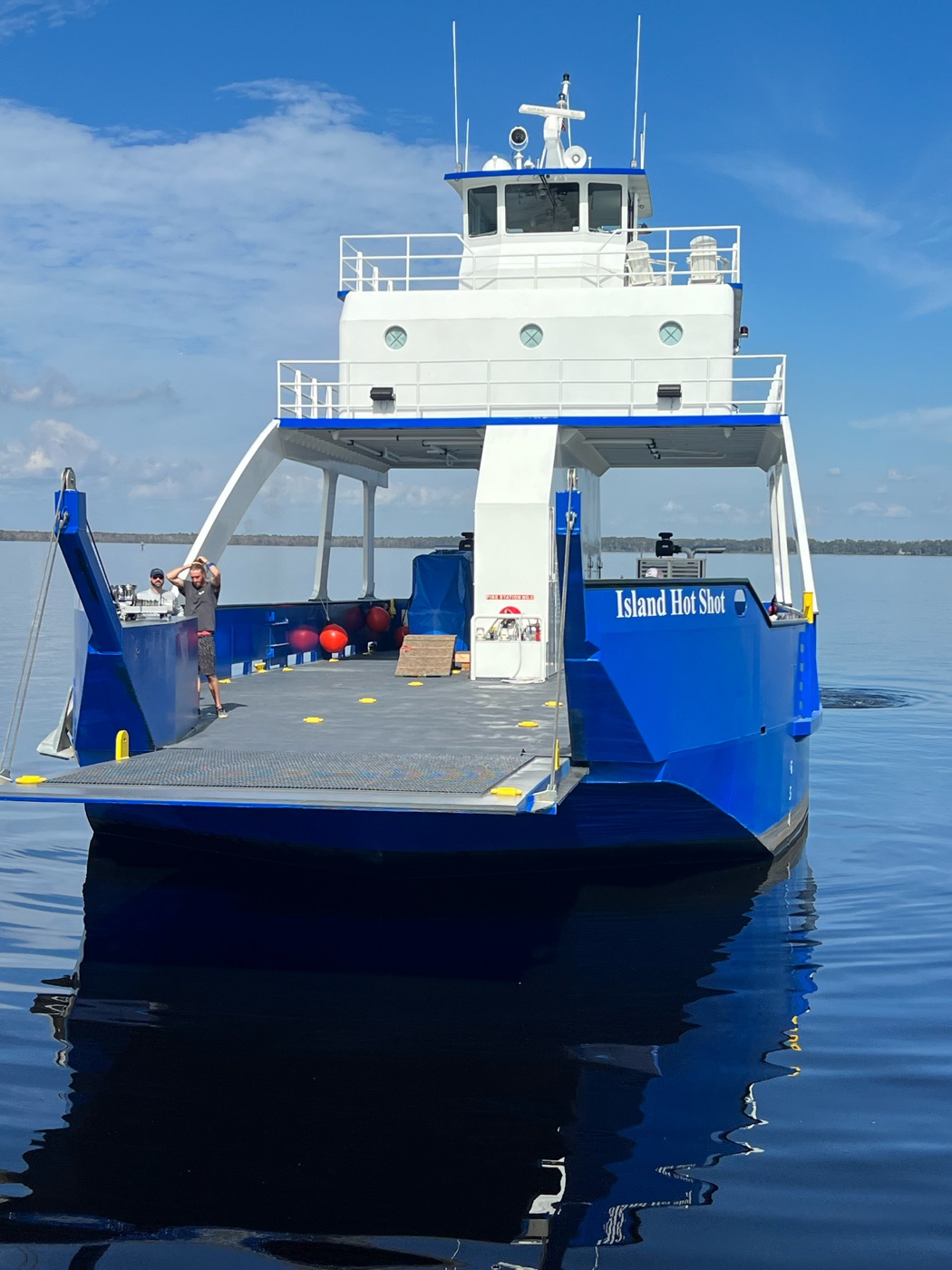 Looking down the open cargo deck from the bow ramp toward the wheelhouse