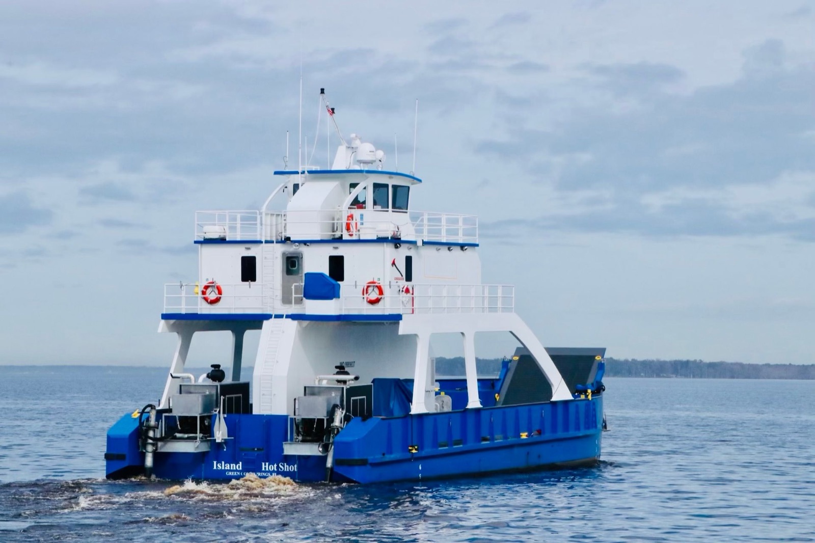 The Island Hot Shot underway on open water, stern quarter view